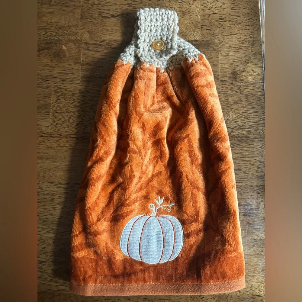 Hand crocheted orange fall towel with embroidered pumpkin